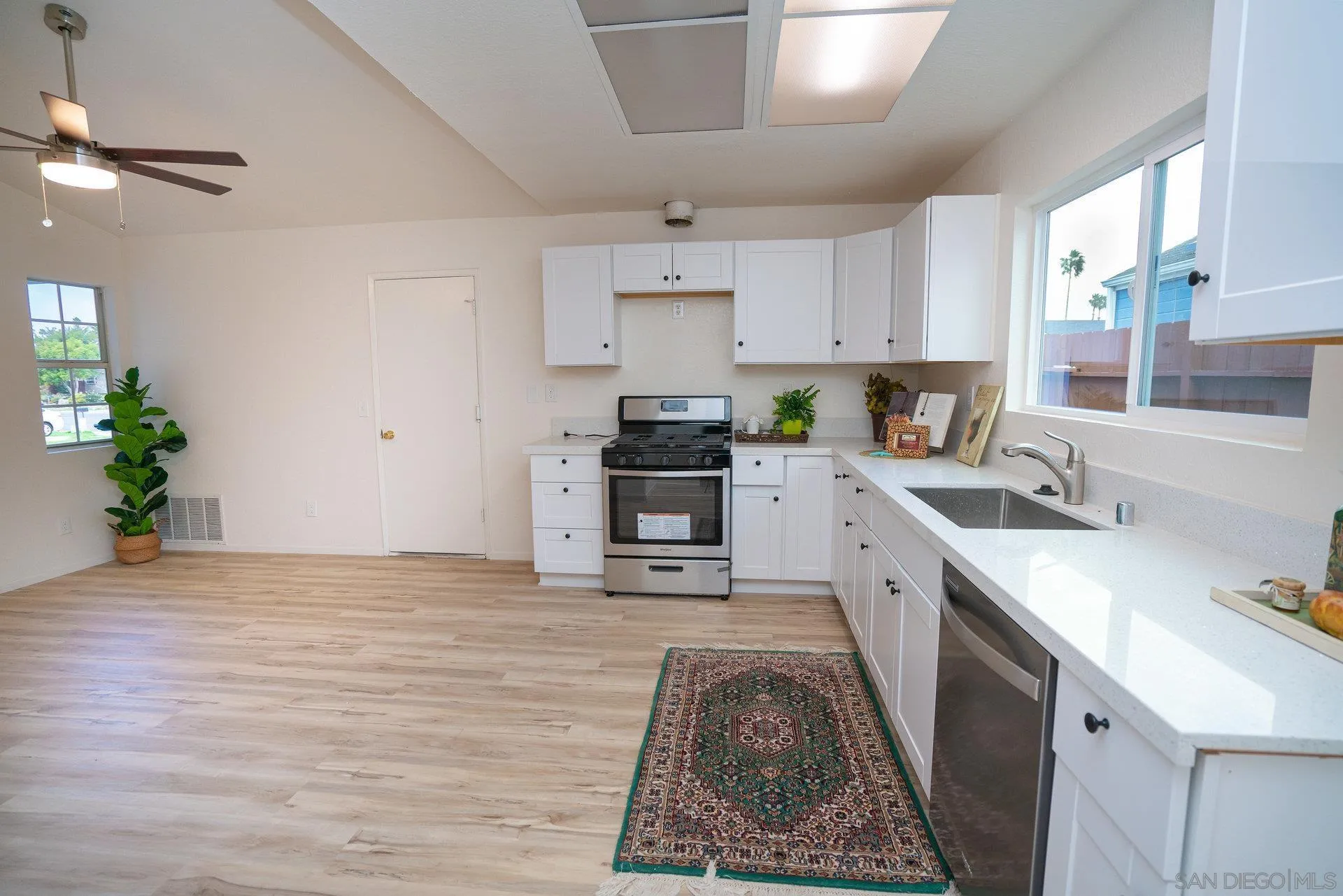 5145 Francis Street Oceanside, CA 92057 - Photo 10 of 21 a kitchen with stainless steel appliances granite countertop a sink stove and refrigerator