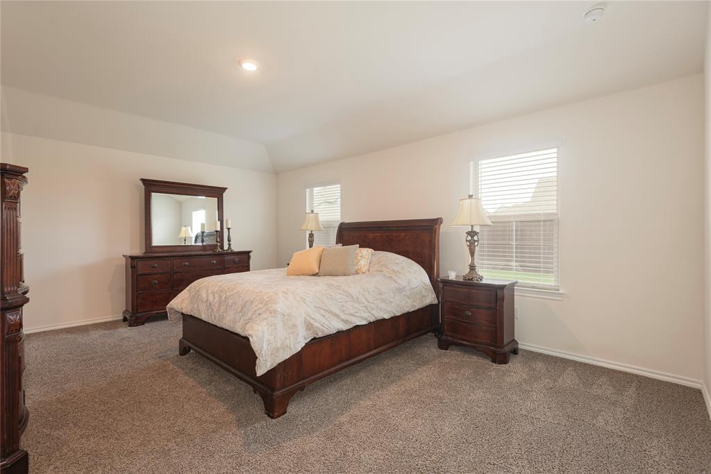 723 Primrose Lane Pilot Point, TX 76258 - Photo 11 of 37 Bedroom with carpet, vaulted ceiling, and recessed lighting