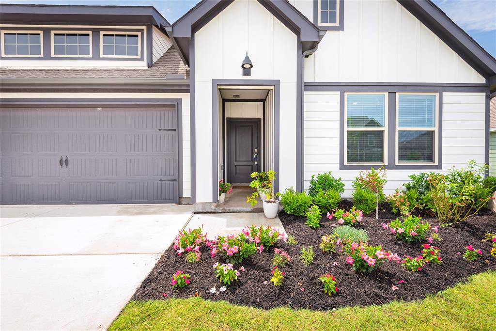 723 Primrose Lane Pilot Point, TX 76258 - Photo 2 of 37 LOVELY LANDSCAPING INVITES YOU TO COVERED FRONT PORCH ENTRY