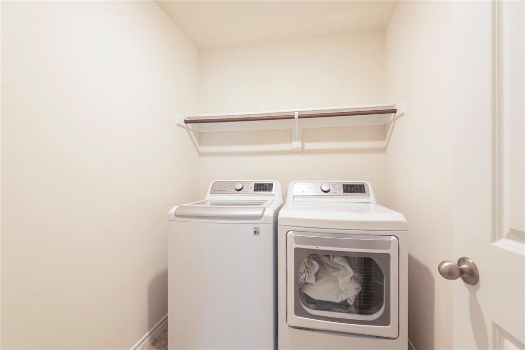 723 Primrose Lane Pilot Point, TX 76258 - Photo 24 of 37 Utility Room with separate washer and dryer and drying rod located just off the Kitchen area