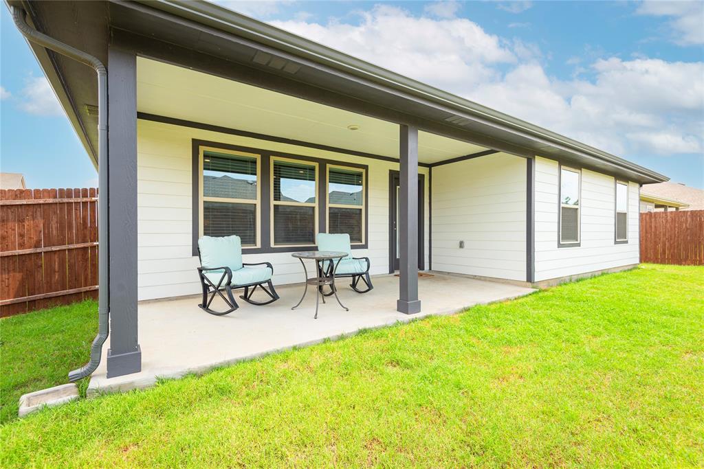 723 Primrose Lane Pilot Point, TX 76258 - Photo 27 of 37 Entertain or create your own personal space with this oversized covered patio!!!
