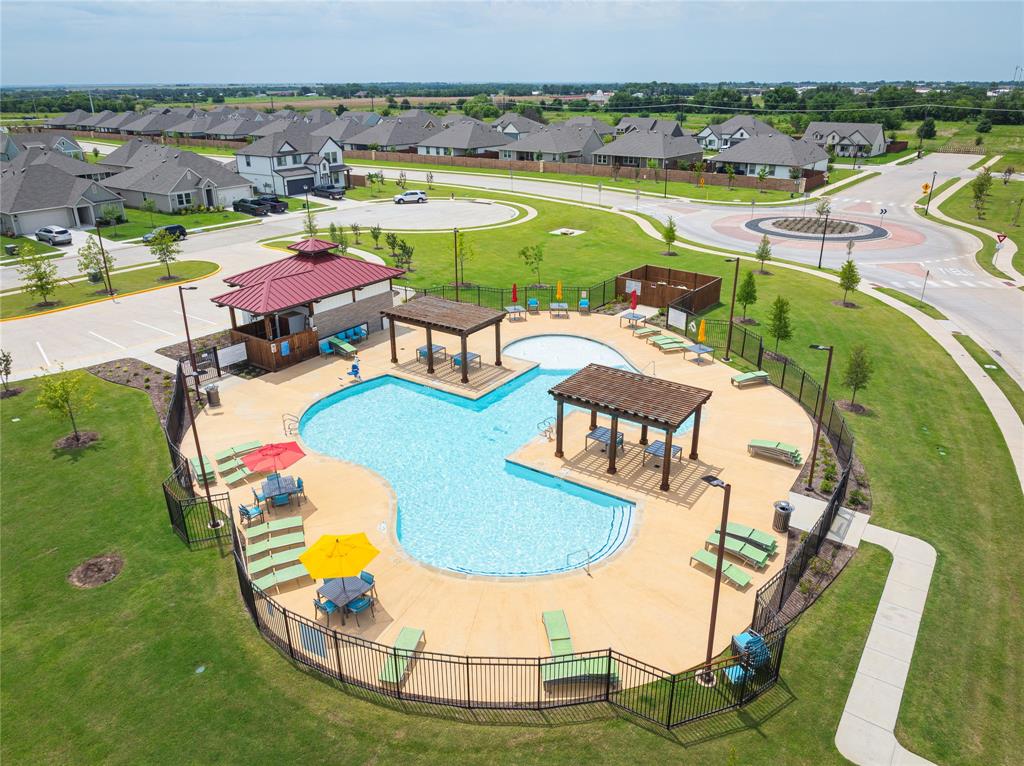 723 Primrose Lane Pilot Point, TX 76258 - Photo 34 of 37 Community pool with a residential view and a gazebo and bathrooms
