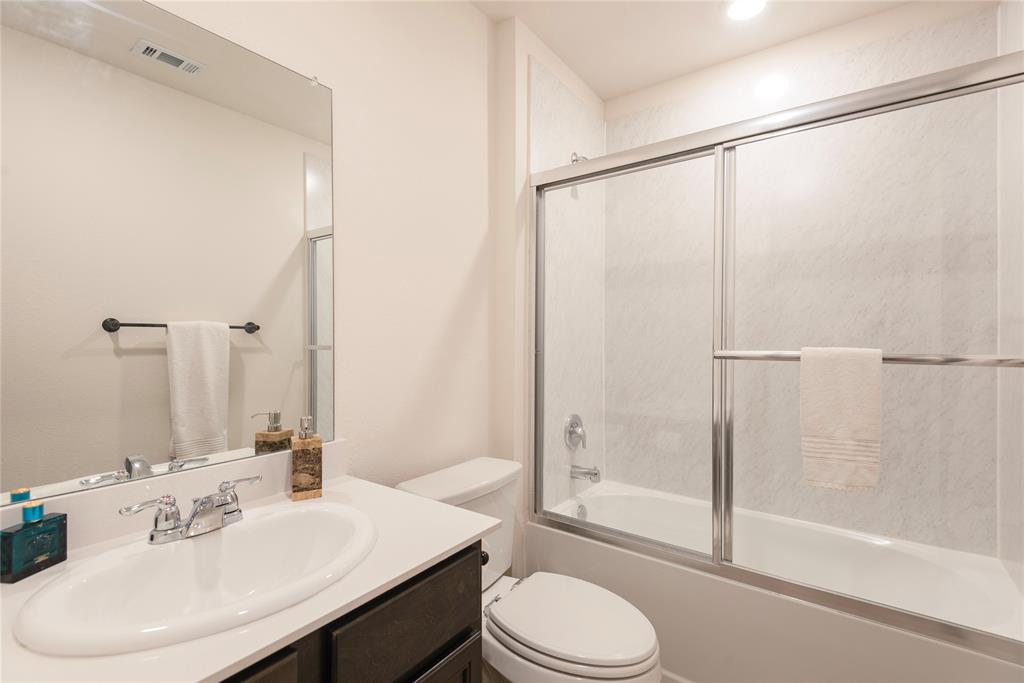 723 Primrose Lane Pilot Point, TX 76258 - Photo 8 of 37 Secondary Full bath featuring vanity, shower / bath combination with glass door, and recessed lighting