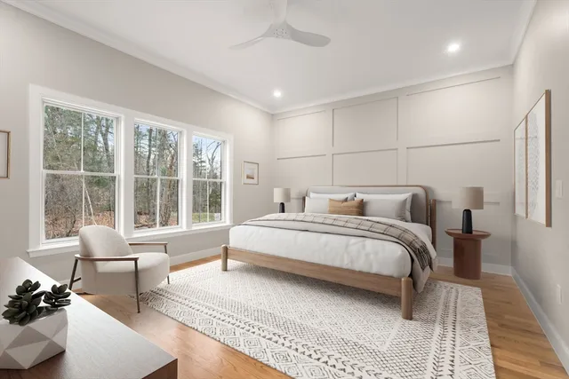 a spacious bedroom with a bed and a large window