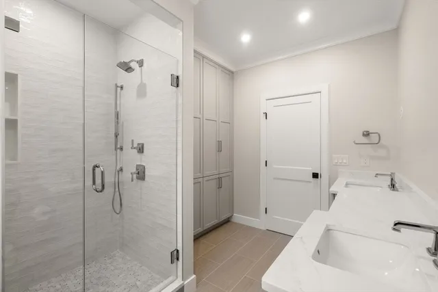 a bathroom with a bathtub and shower