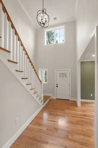 a view of an entryway with wooden floor