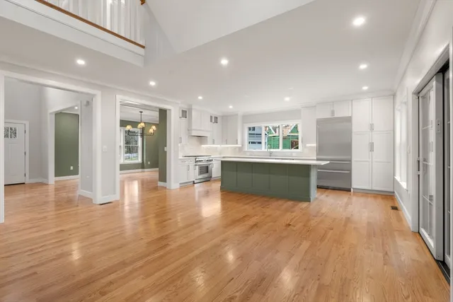a view of kitchen with wooden floor and windows