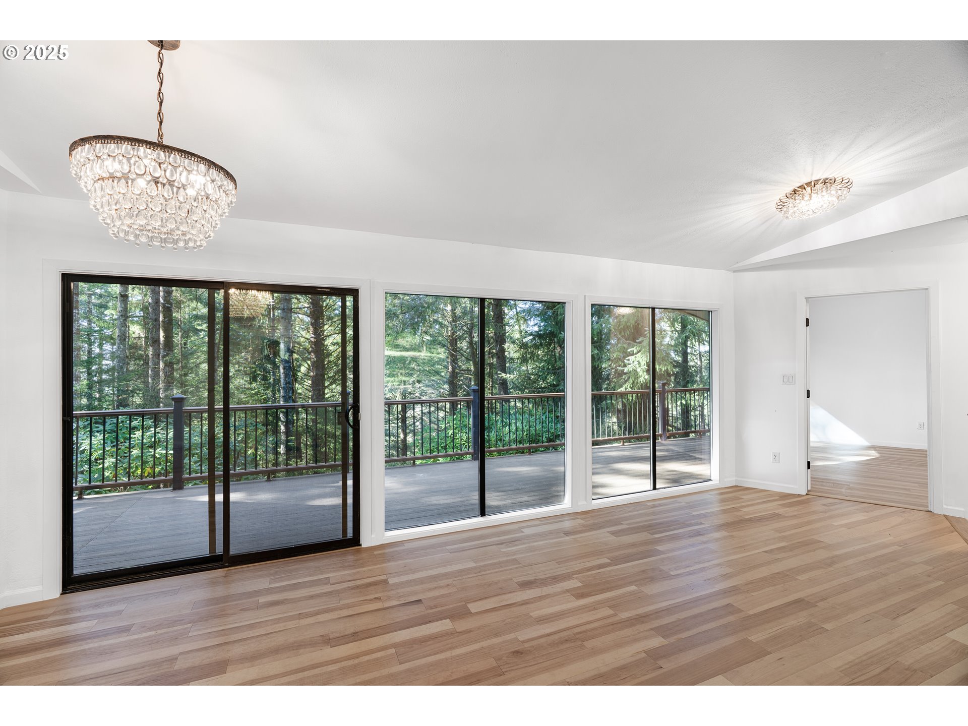 95708 Horton Lane Brookings, OR 97415 - Photo 15 of 46 a view of an empty room with wooden floor and a window