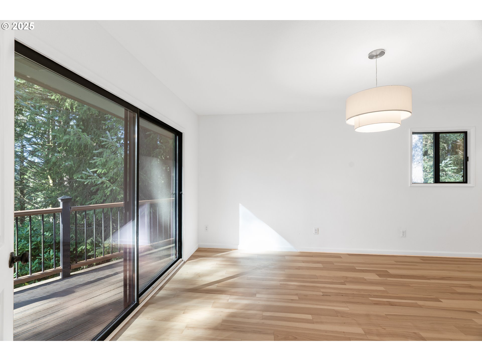 95708 Horton Lane Brookings, OR 97415 - Photo 18 of 46 a view of a room with wooden floor and windows