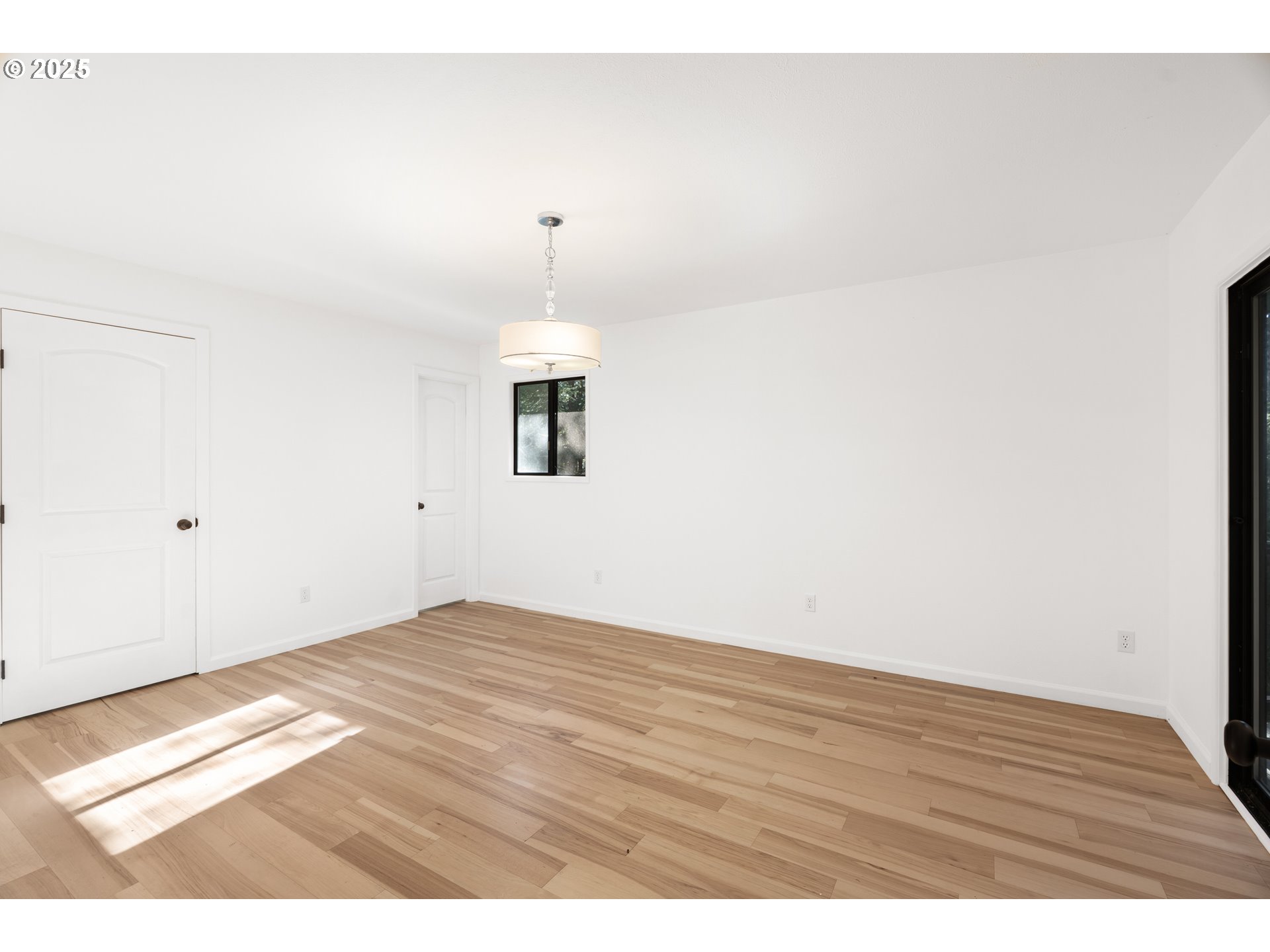 95708 Horton Lane Brookings, OR 97415 - Photo 23 of 46 a view of an empty room with wooden floor