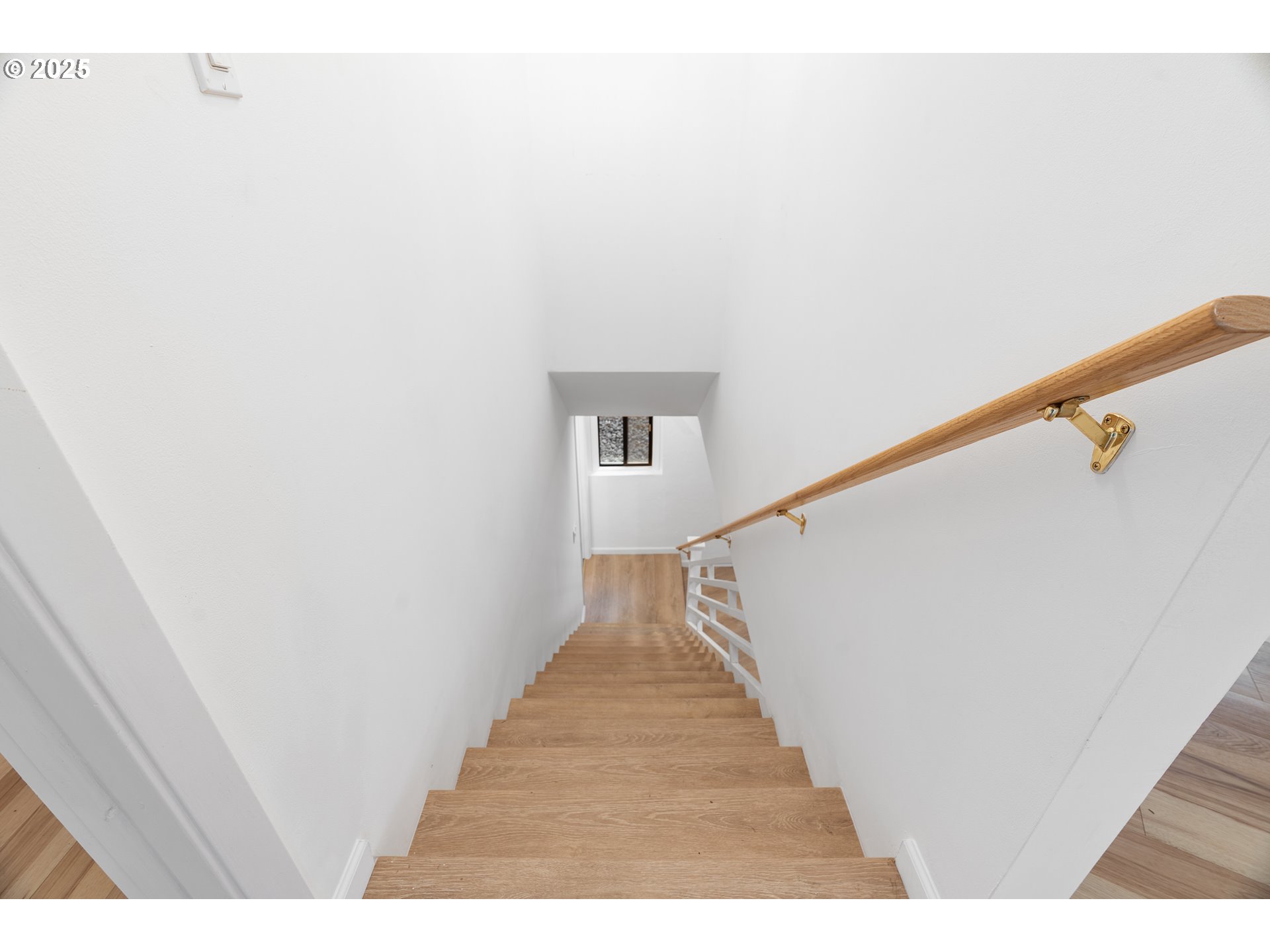 95708 Horton Lane Brookings, OR 97415 - Photo 29 of 46 a view of a hallway with wooden floor and stairs