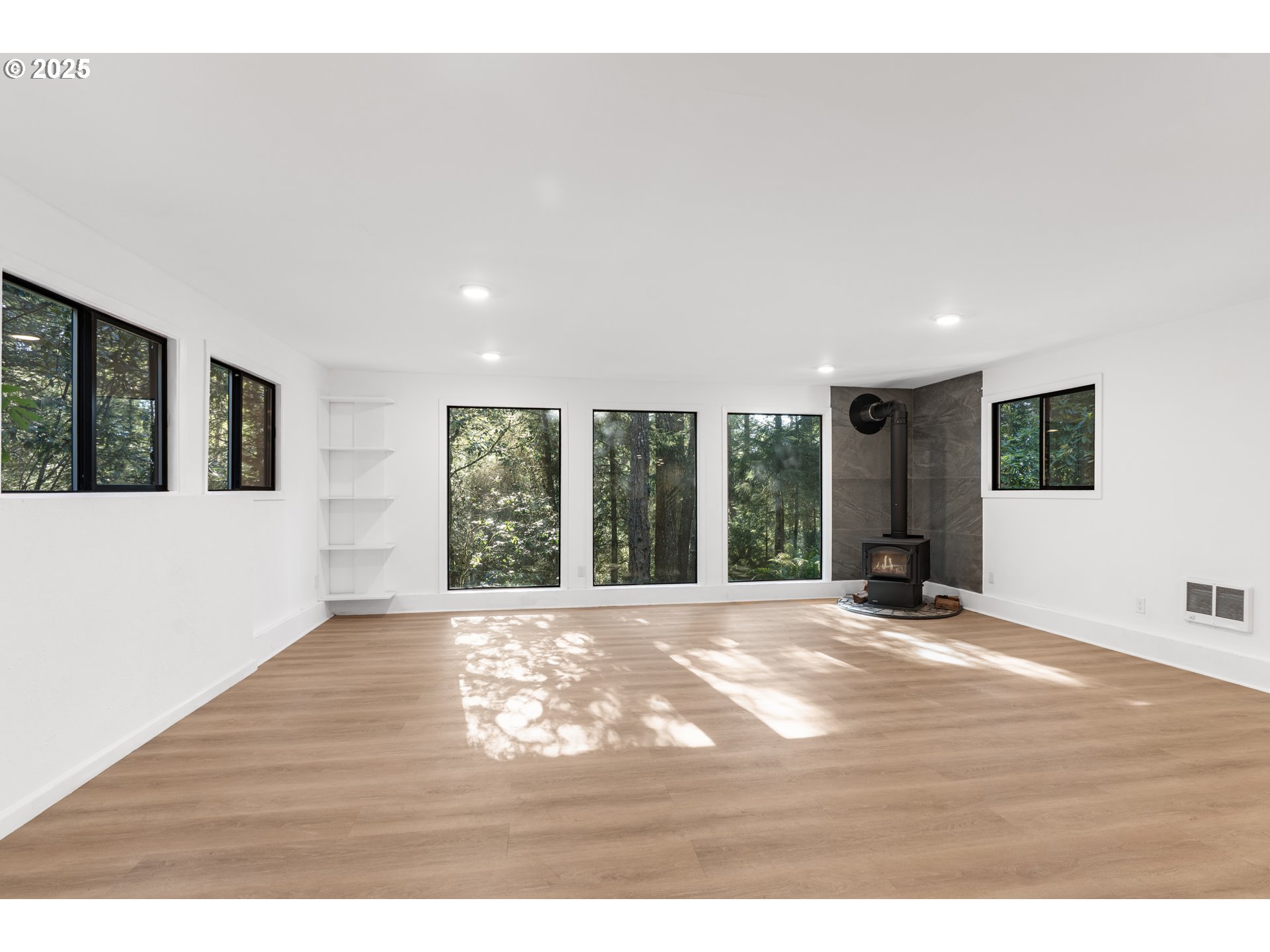 95708 Horton Lane Brookings, OR 97415 - Photo 34 of 46 a view of an empty room with wooden floor and a window