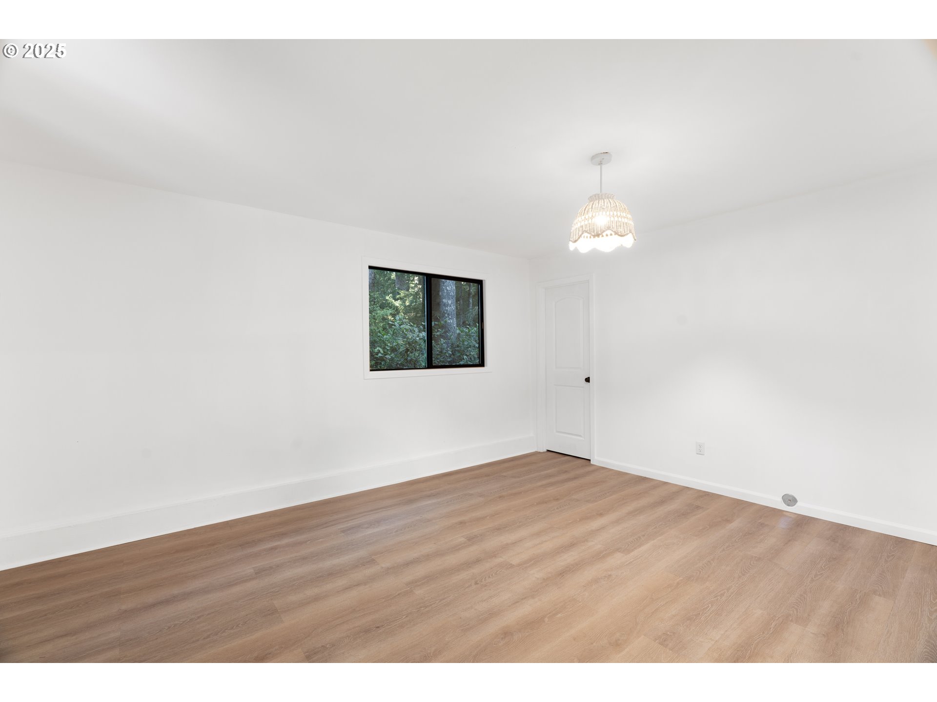 95708 Horton Lane Brookings, OR 97415 - Photo 37 of 46 a view of an empty room with wooden floor and a window