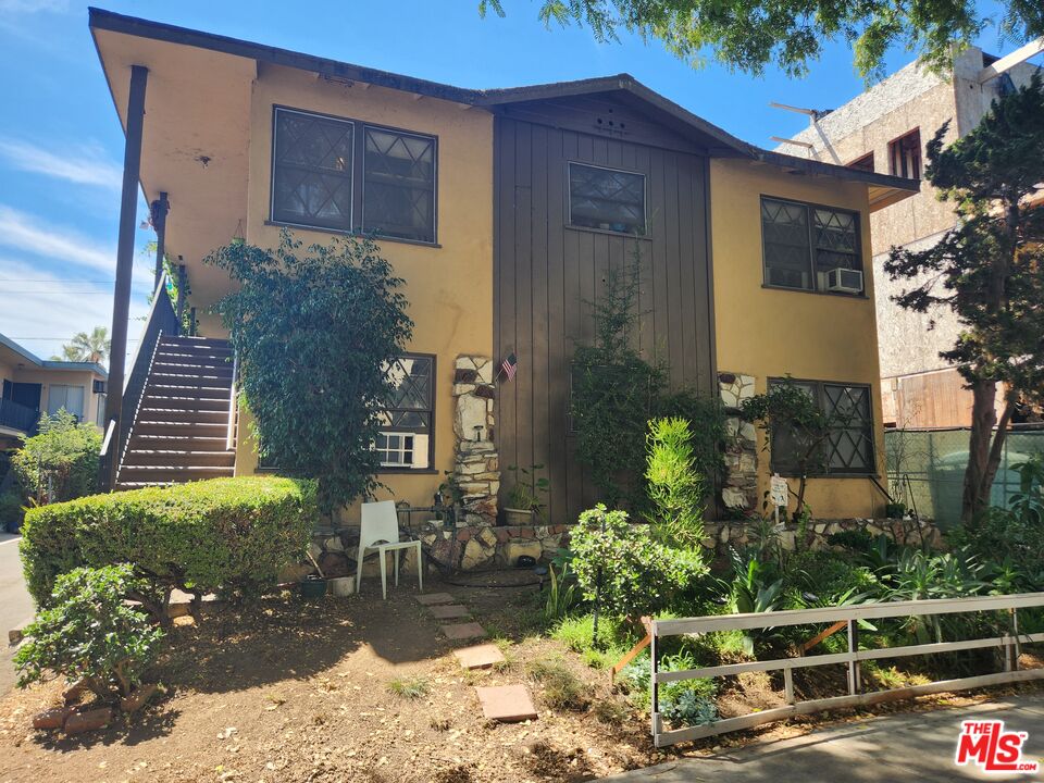 939 North Stanley Avenue, Unit 6 West Hollywood, CA 90046 - Photo 11 of 11 a view of a house with a yard