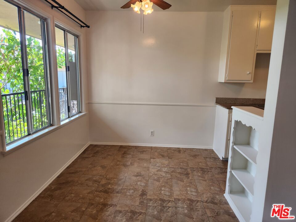 939 North Stanley Avenue, Unit 6 West Hollywood, CA 90046 - Photo 4 of 11 a view of small space with sliding door and wooden floor
