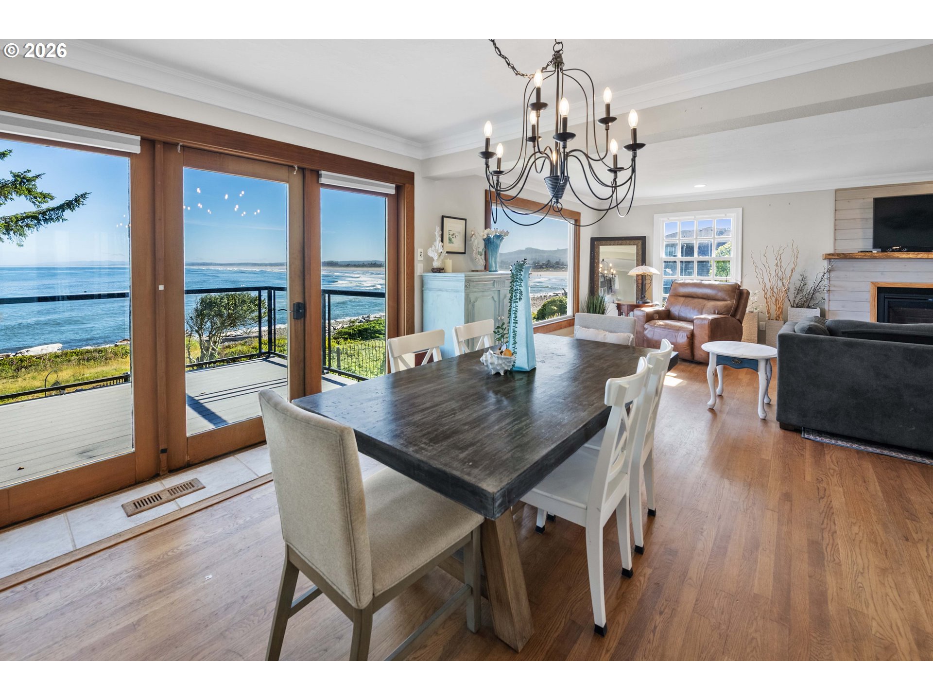 3232 Sunset Boulevard Seaside, OR 97138 - Photo 6 of 48 a view of a dining room with furniture wooden floor and chandelier