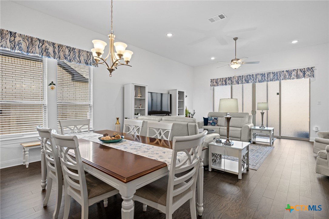 3009 Sage Ranch Drive Leander, TX 78641 - Photo 15 of 43 a view of a dining room with furniture window and wooden floor