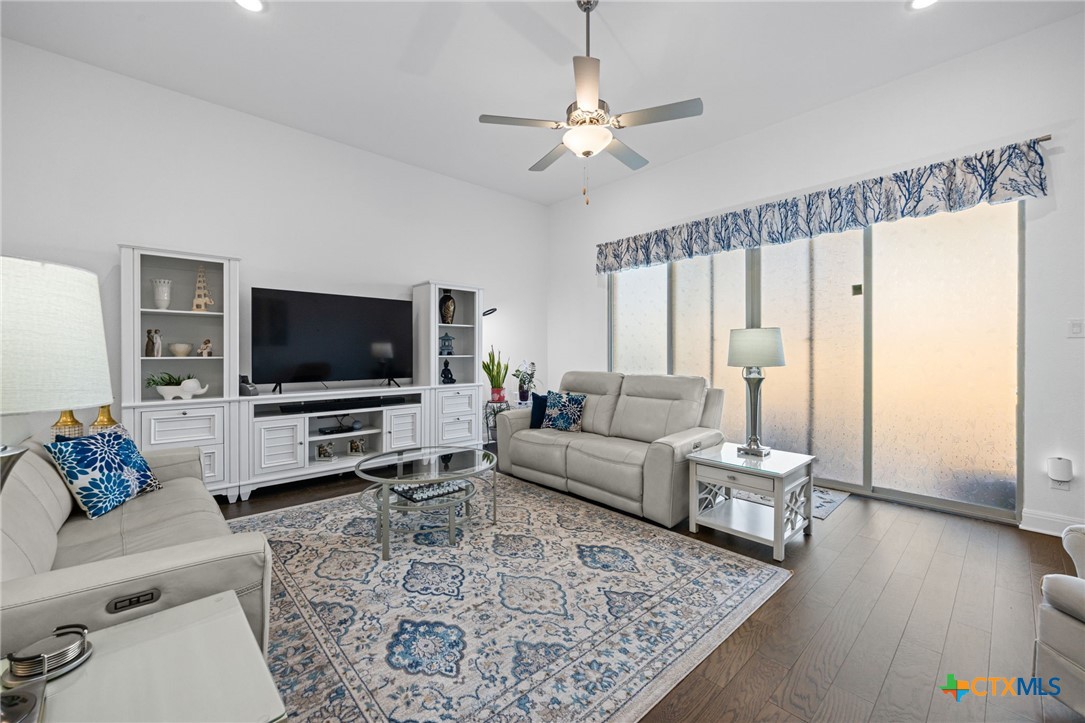 3009 Sage Ranch Drive Leander, TX 78641 - Photo 18 of 43 a living room with furniture and a flat screen tv