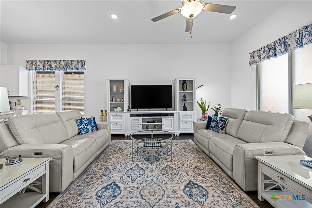 3009 Sage Ranch Drive Leander, TX 78641 - Photo 19 of 43 a living room with furniture and a flat screen tv