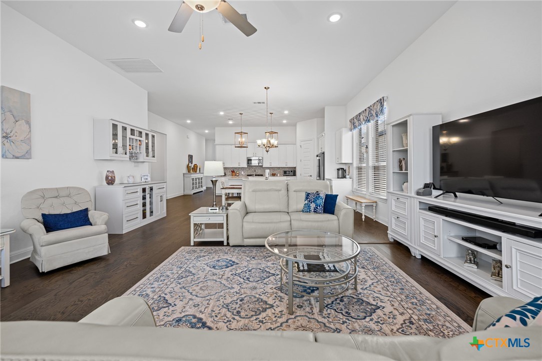 3009 Sage Ranch Drive Leander, TX 78641 - Photo 21 of 43 a living room with furniture and a flat screen tv