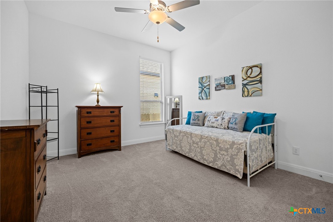 3009 Sage Ranch Drive Leander, TX 78641 - Photo 26 of 43 a living room with furniture and a ceiling fan