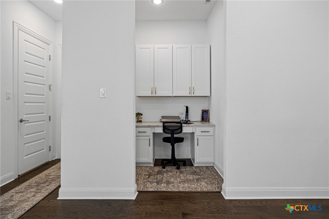 3009 Sage Ranch Drive Leander, TX 78641 - Photo 38 of 43 a view of kitchen island with cabinets
