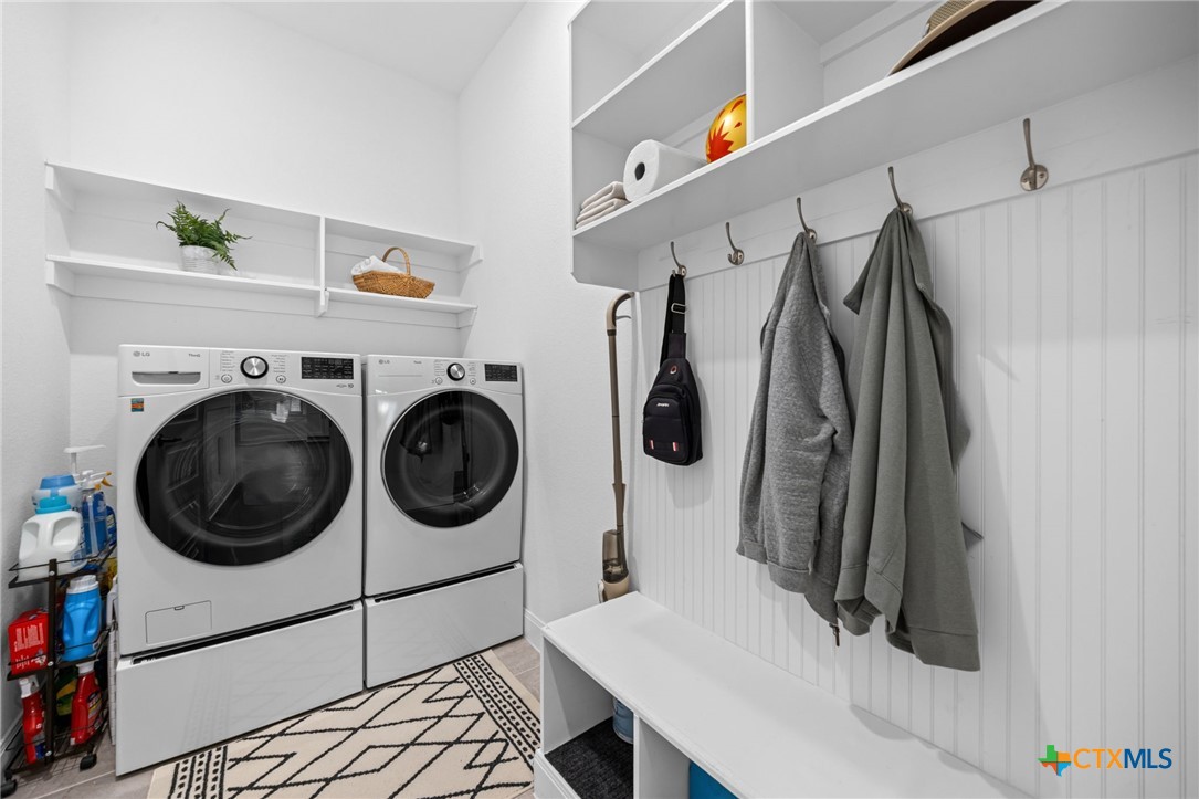 3009 Sage Ranch Drive Leander, TX 78641 - Photo 39 of 43 a utility room with dryer and washer