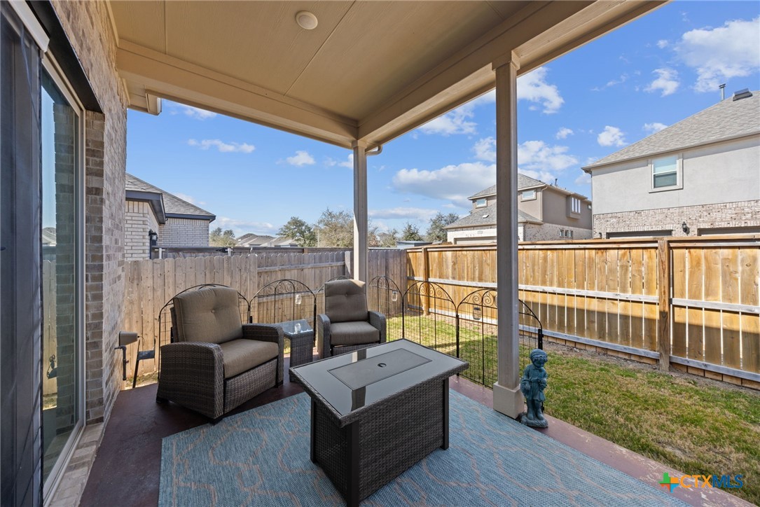 3009 Sage Ranch Drive Leander, TX 78641 - Photo 41 of 43 a living room with furniture and a floor to ceiling window