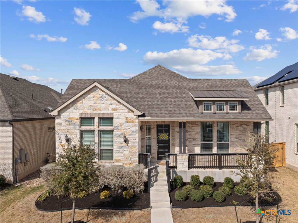 3009 Sage Ranch Drive Leander, TX 78641 - Photo 42 of 43 a front view of a house with a yard