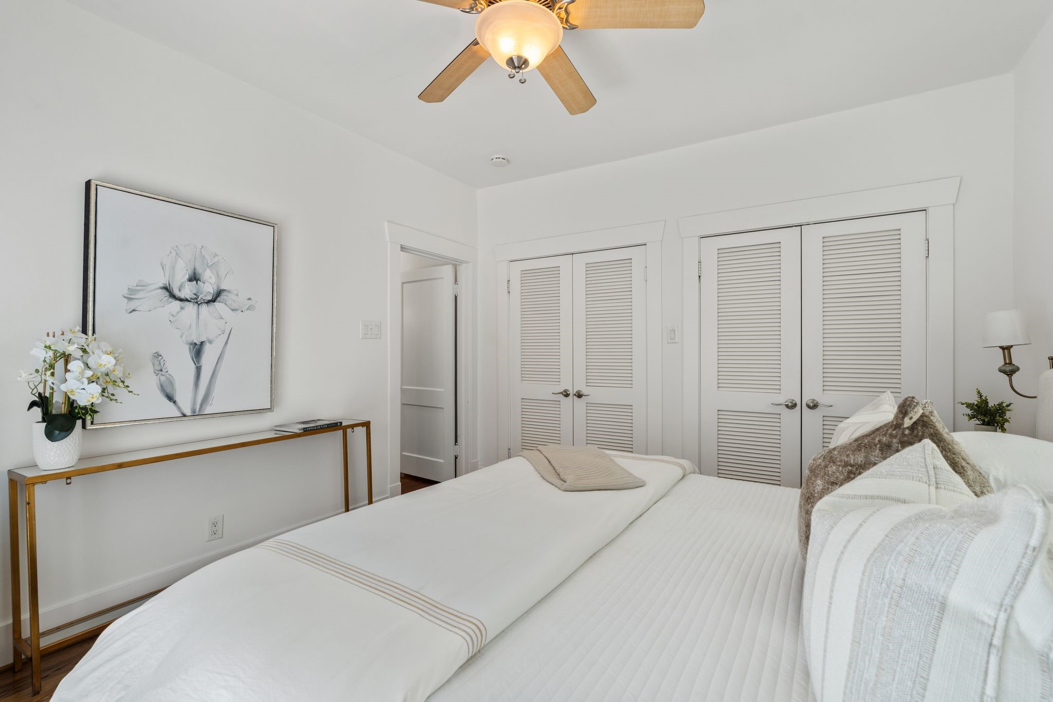 714 Ridge Street Houston, TX 77009 - Photo 16 of 36 Double closets with louvered doors provide generous wardrobe storage in the primary bedroom.