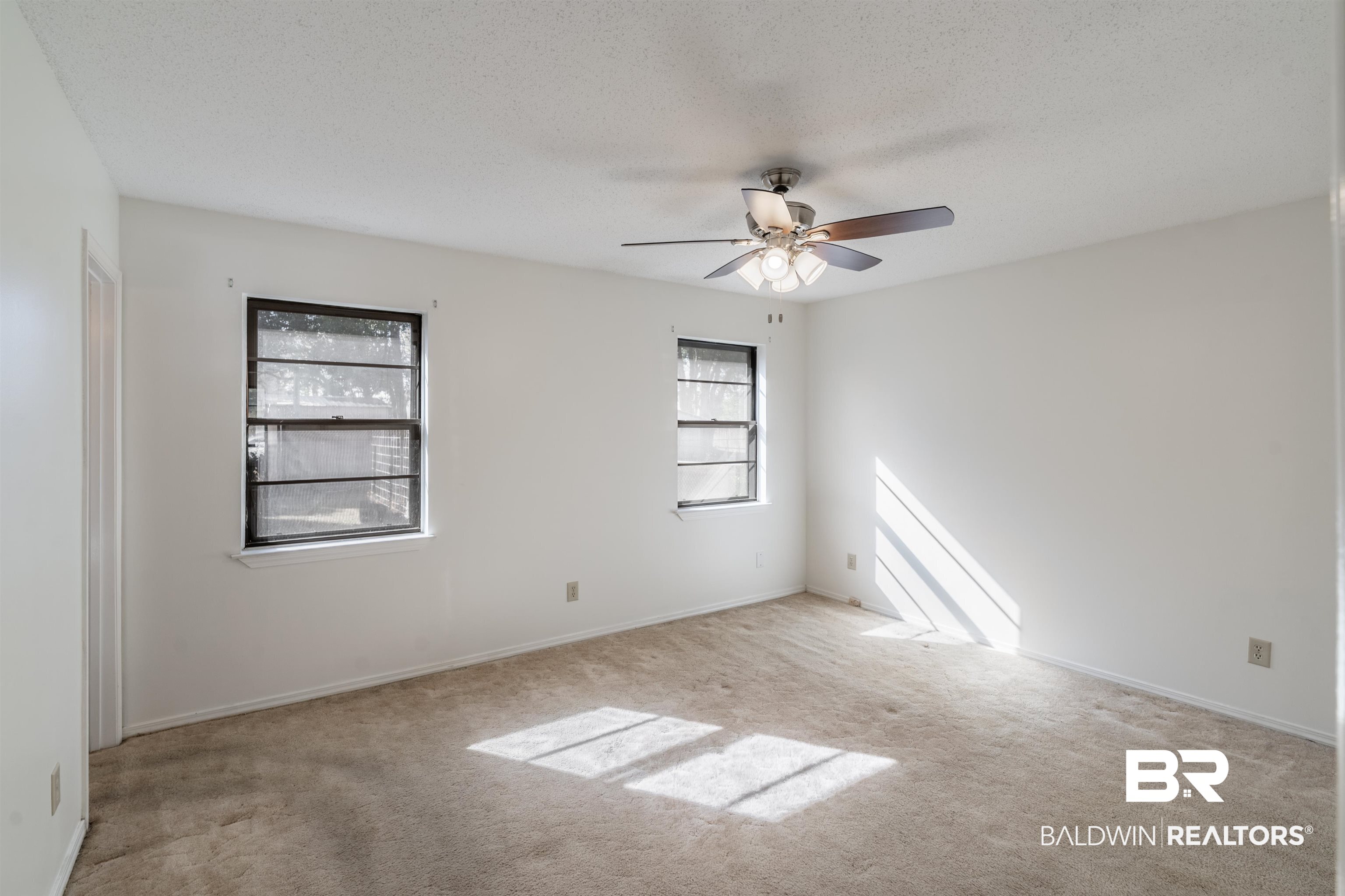 9751 Pine Knoll Road Mobile, AL 36608 - Photo 23 of 36 Unfurnished room with light carpet, ceiling fan, and a textured ceiling