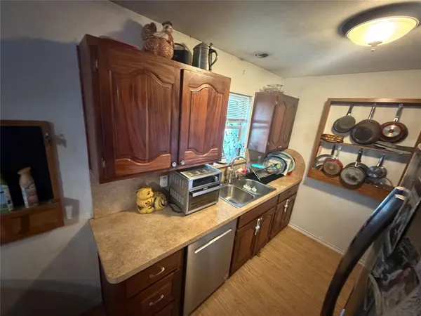 a kitchen with stainless steel appliances granite countertop a stove and a sink