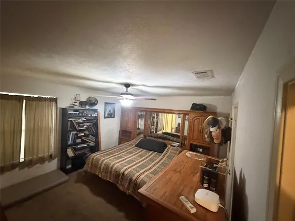 a bedroom with a bed and closet