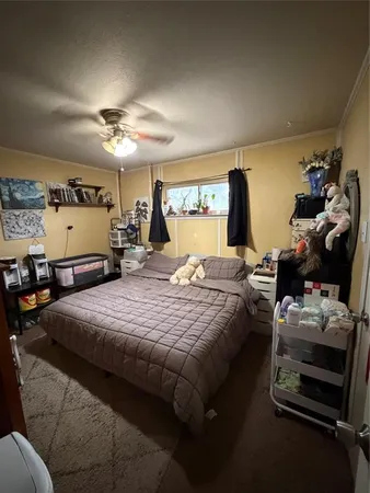 a bedroom with bed and window