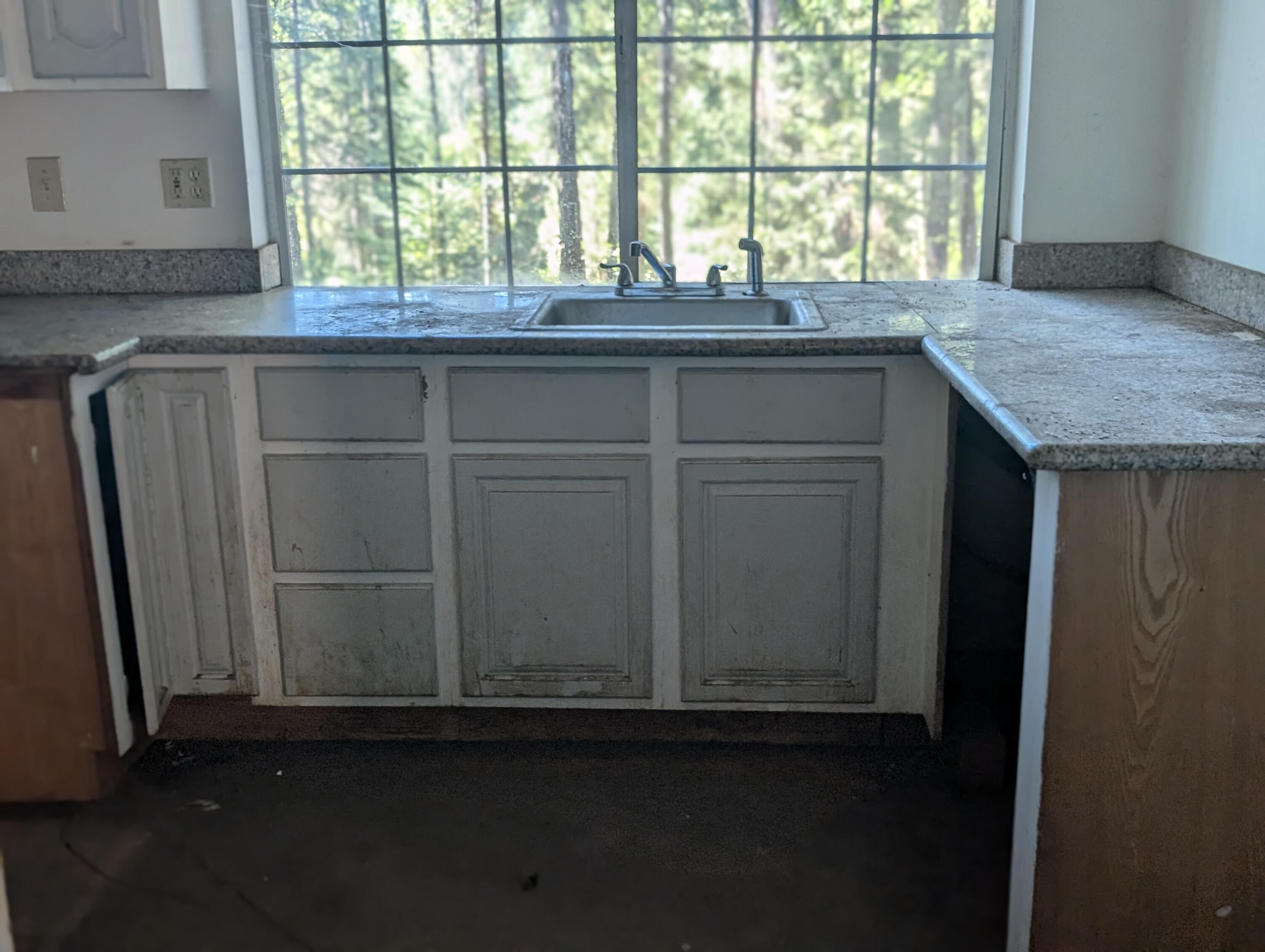 211 Goa Way Lewiston, CA 96052 - Photo 28 of 44 a kitchen with granite countertop cabinets and window