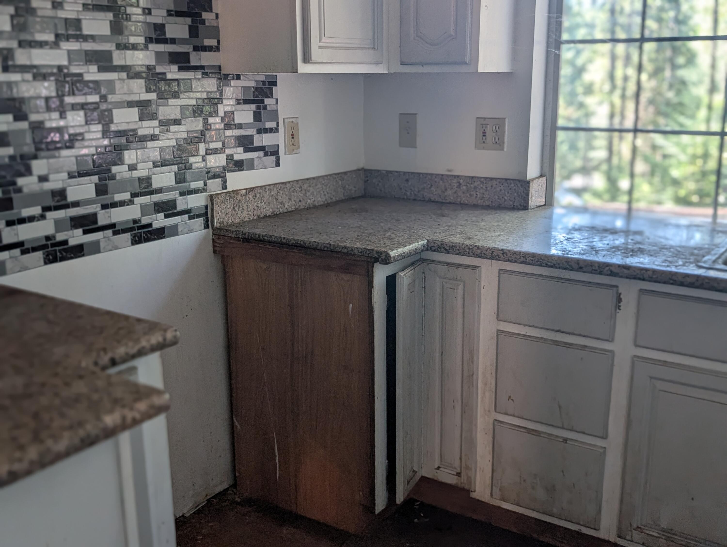 211 Goa Way Lewiston, CA 96052 - Photo 29 of 44 a kitchen with granite countertop a sink and a stove