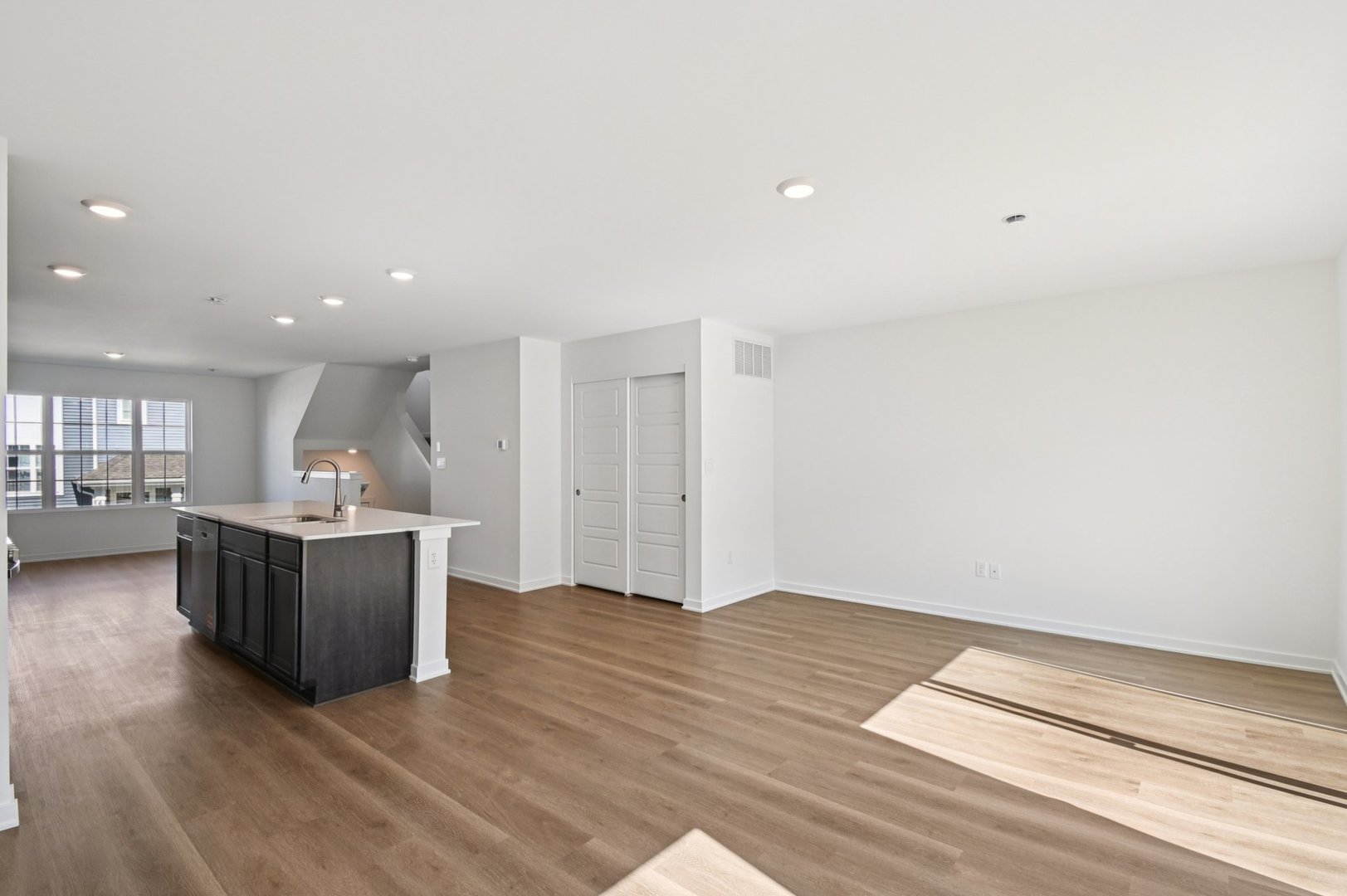 1433 Oakfield Lane Pingree Grove, IL 60140 - Photo 13 of 75 a view of an empty room with kitchen and window