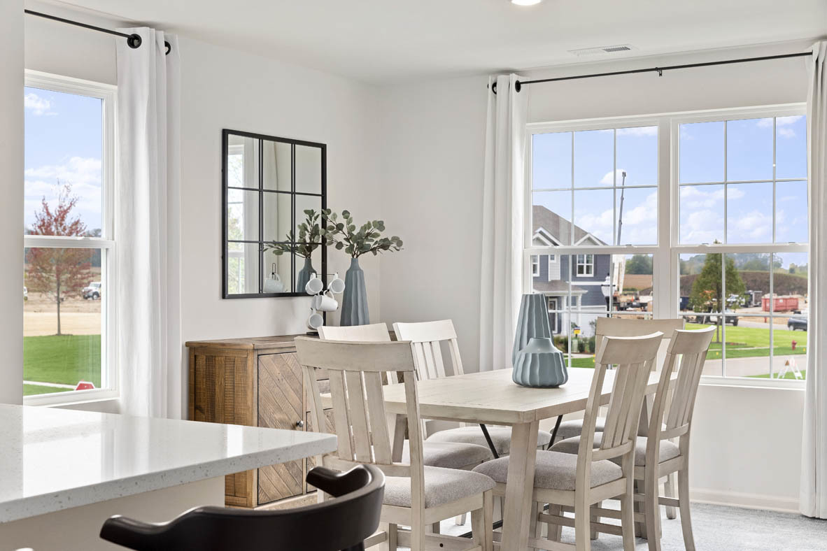 1433 Oakfield Lane Pingree Grove, IL 60140 - Photo 45 of 75 a dining room with furniture a rug and a large window
