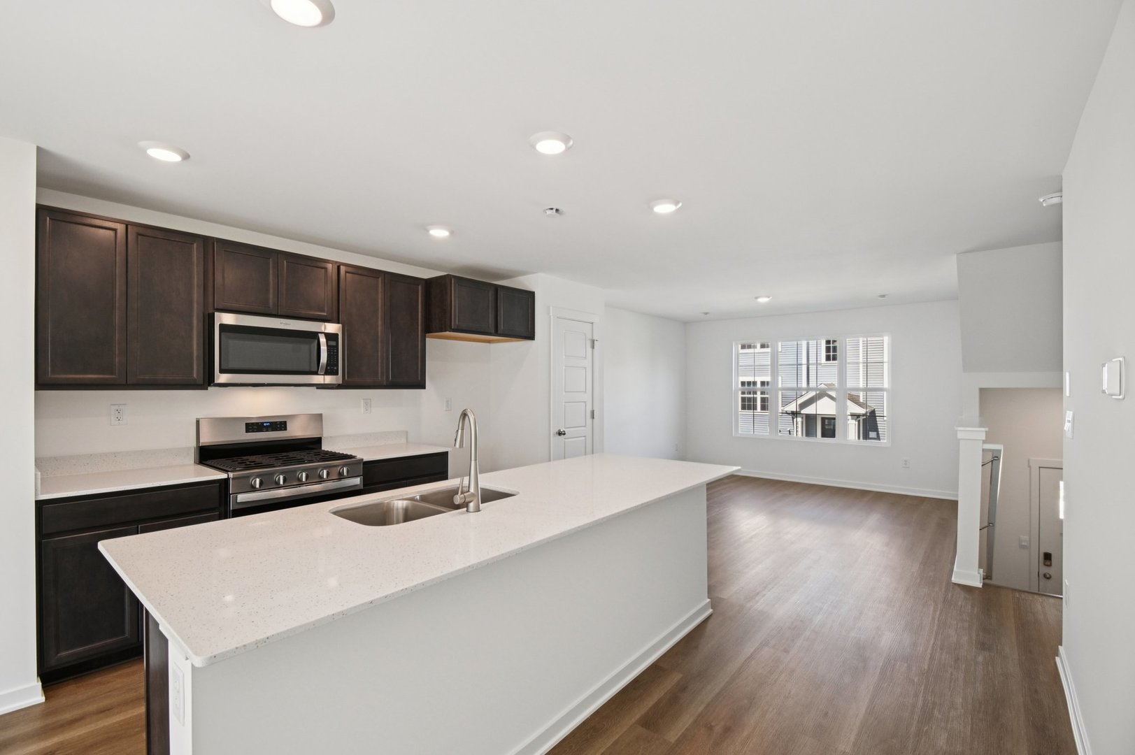 1433 Oakfield Lane Pingree Grove, IL 60140 - Photo 6 of 75 a kitchen with granite countertop a stove a sink dishwasher and a refrigerator with wooden floor