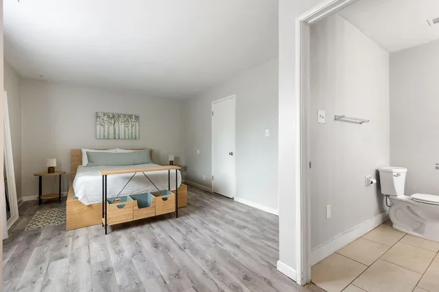 a room with a bed and a cabinets