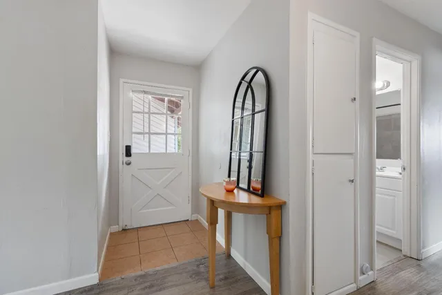 a view of an entryway with mirror