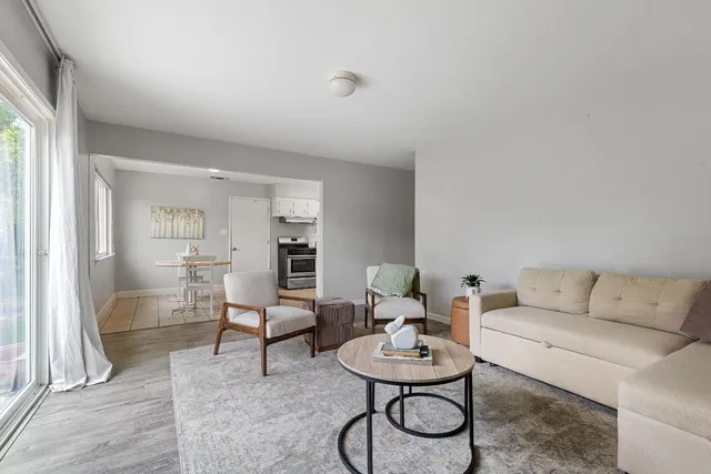 a living room with furniture and a table