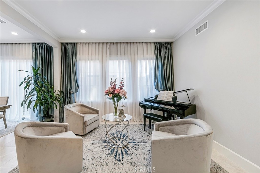 65 Rockinghorse Irvine, CA 92602 - Photo 11 of 43 a living room with furniture and a potted plant