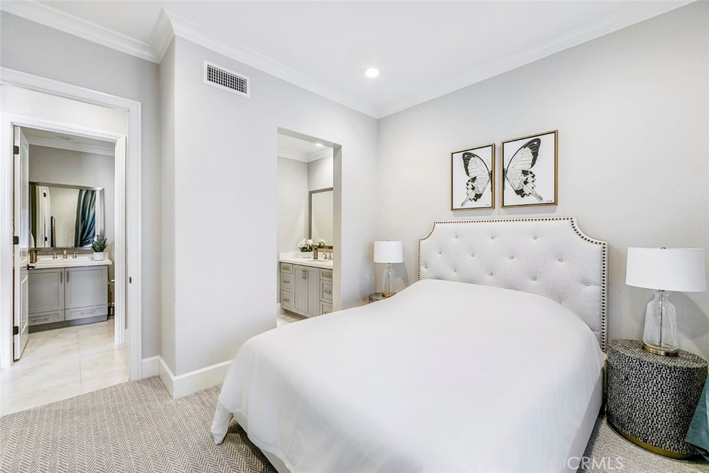 65 Rockinghorse Irvine, CA 92602 - Photo 31 of 43 a spacious bedroom with a bed and a view of bathroom