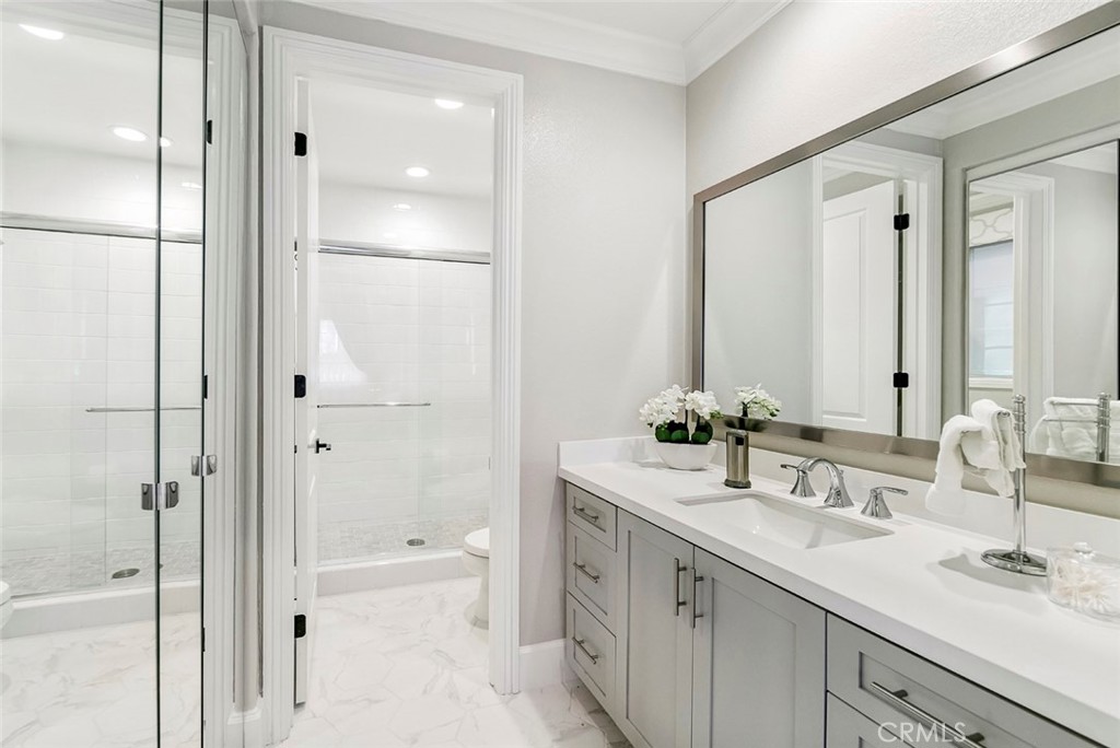 65 Rockinghorse Irvine, CA 92602 - Photo 32 of 43 a bathroom with a double vanity sink mirror double and shower