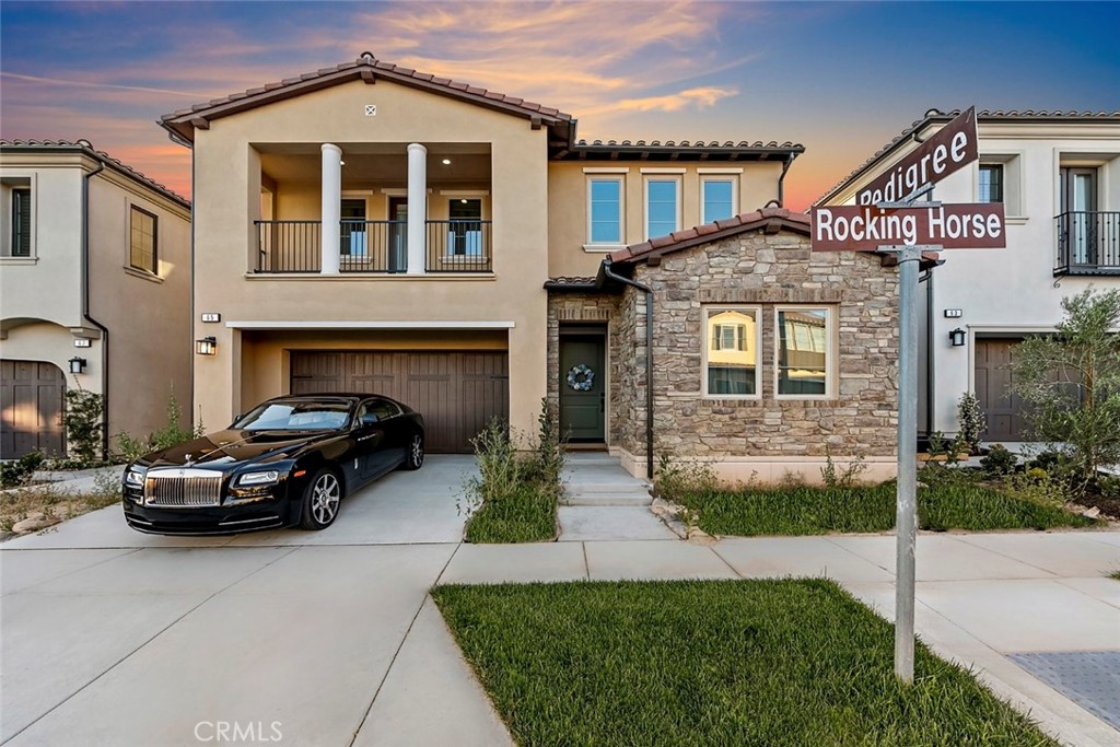 65 Rockinghorse Irvine, CA 92602 - Photo 5 of 43 a car parked in front of a house