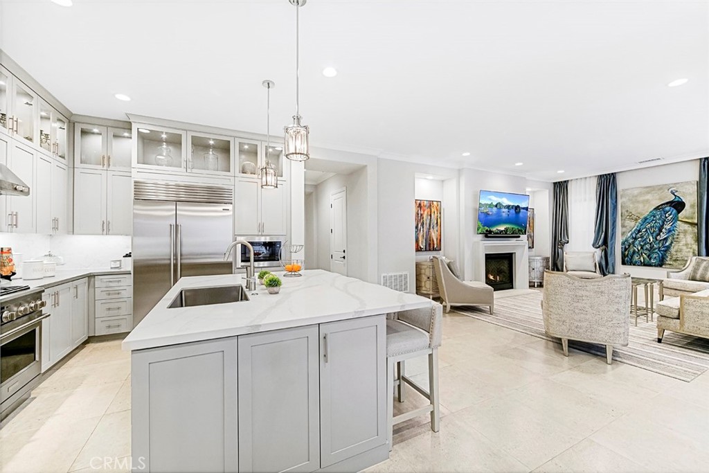 65 Rockinghorse Irvine, CA 92602 - Photo 6 of 43 a kitchen that has a lot of white cabinets and stainless steel appliances