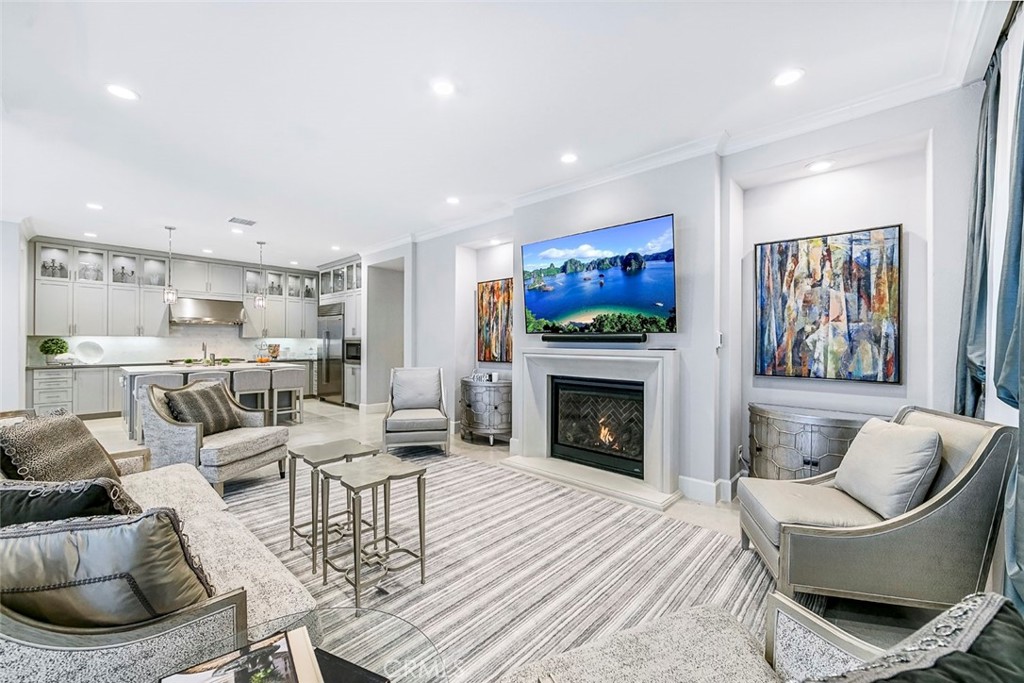 65 Rockinghorse Irvine, CA 92602 - Photo 8 of 43 a living room with furniture and a fireplace