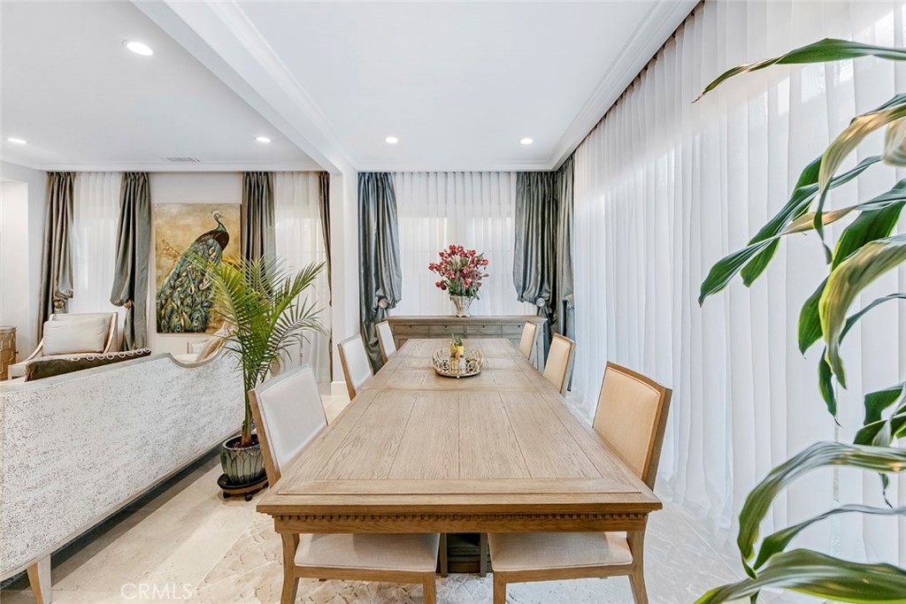 65 Rockinghorse Irvine, CA 92602 - Photo 10 of 43 a dining room with furniture a potted plant and a rug