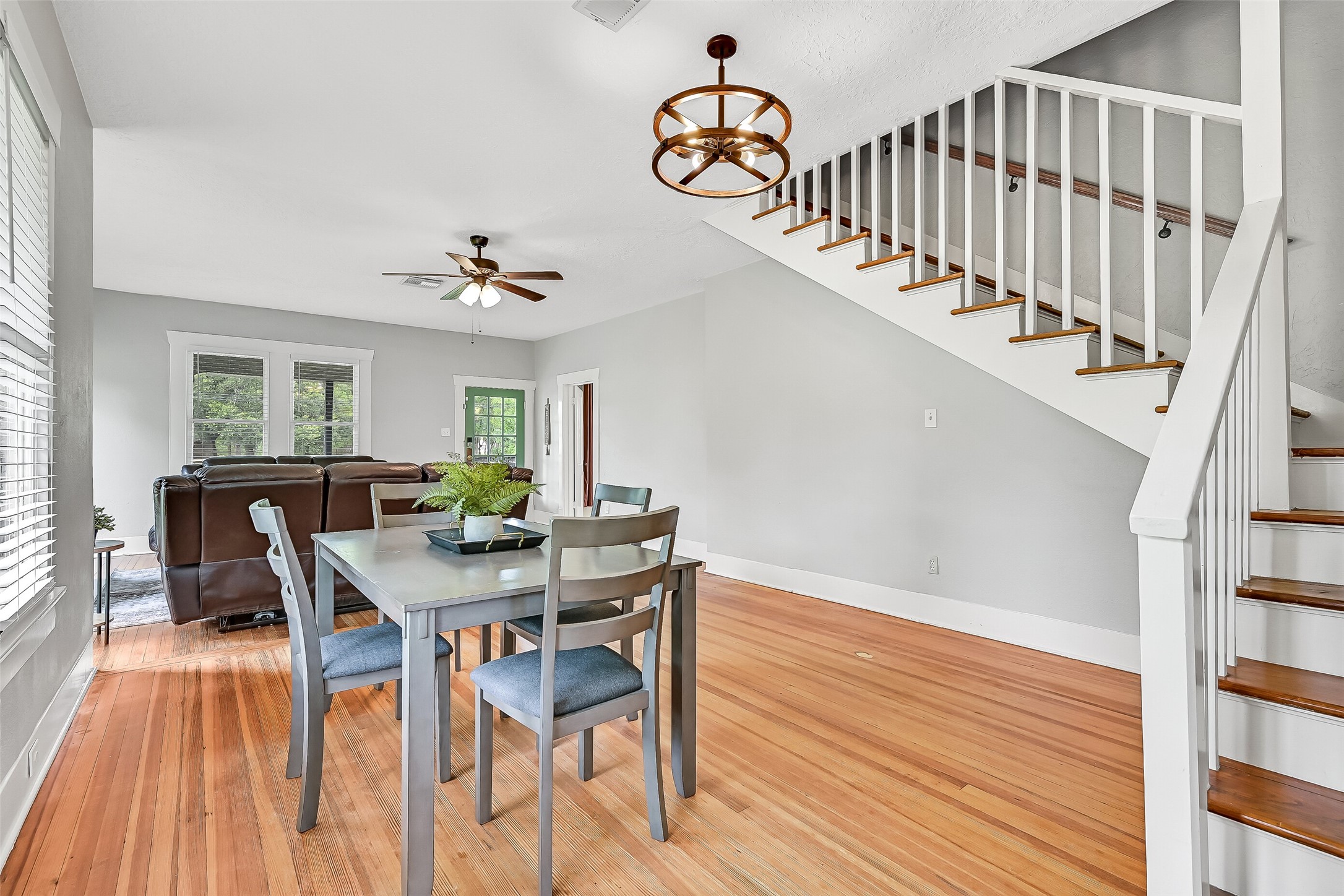 16724 Harkey Road Pearland, TX 77584 - Photo 14 of 34 The dining area is located just off the kitchen and has plenty of space for large gatherings. Original hardwood floors, wall of sunlit windows, and updated chandelier are some of the features!